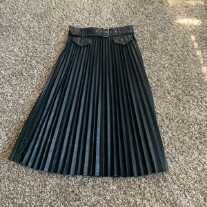 Black faux leather pleated skirt with belt